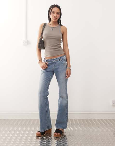 Weekday - Flared jeans met lage taille en westerndetail met knopen aan de zijkant in streperige blauwe wassing - view 1