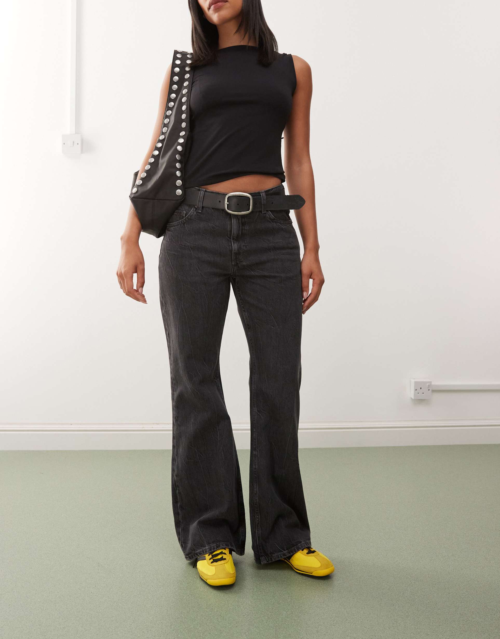 weekday helix low waist wide flare jeans in worn black wash