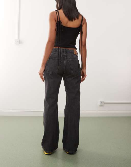 Weekday Helix low waist wide flare jeans in worn black wash
