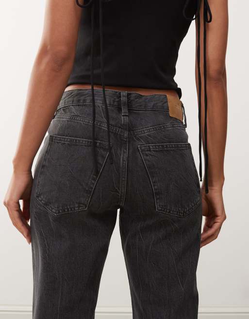Weekday Helix low waist wide flare jeans in worn black wash