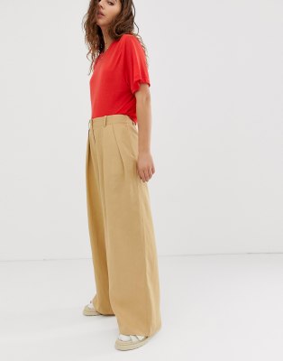 beige high waisted trousers