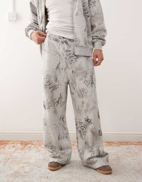 Weekday - Joggers con fondo ampio grigio mélange con stampa grafica stile scarabocchio in coordinato - view 1