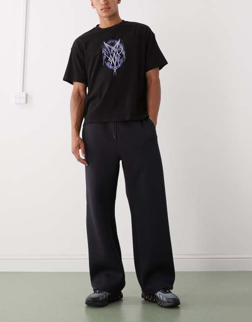 Weekday - Joggingbroek van scubastof met wijde pijpen in donker marineblauw