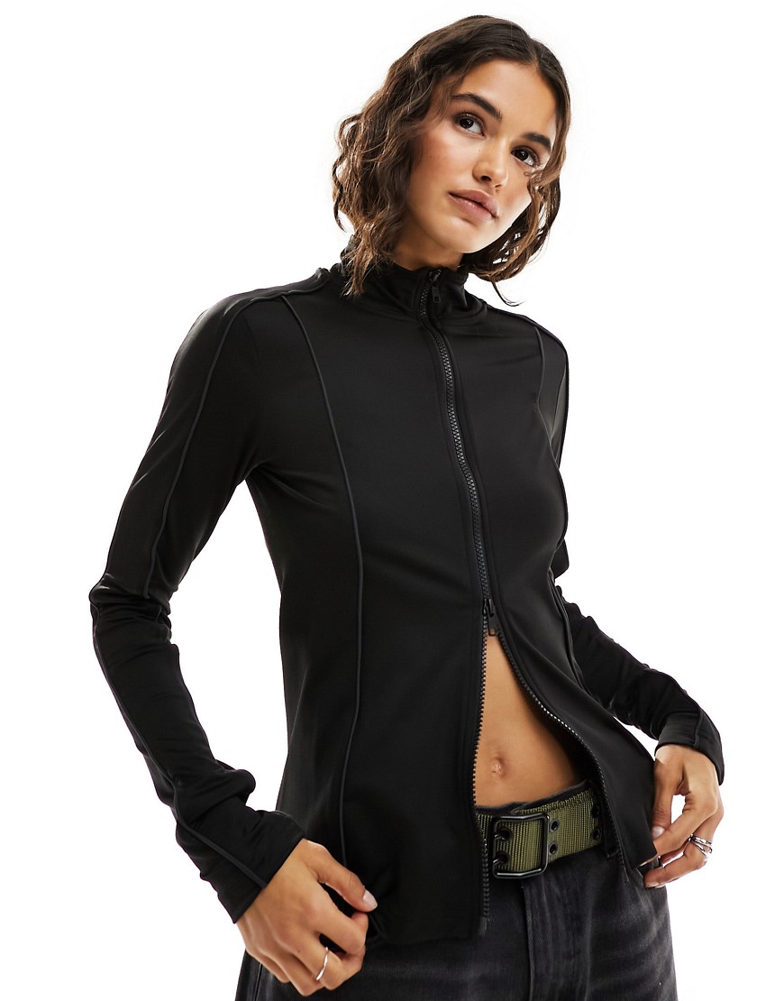Lionella long sleeve zip up top with piping detail in black