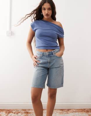 Weekday low waist knee length denim shorts in blue