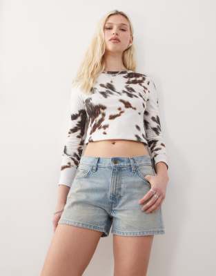 low waist loose fit denim shorts in washed blue