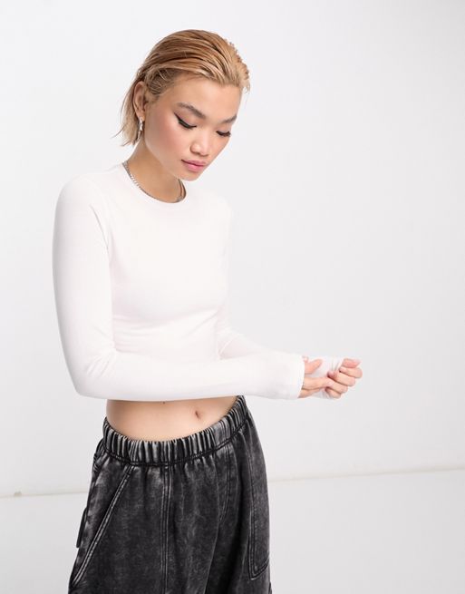 Nike Yoga Luxe Dri-FIT cropped long sleeve top in off white, ASOS