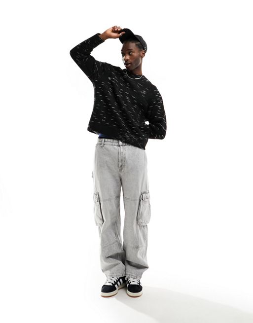 Weekday – Norman – Czarny sweter o luźnym kroju ze wzorem space dye