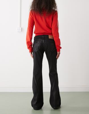 Weekday Nova Low Waist Slim Bootcut Flare Jeans With Twisted Side Seam Detailing In Black