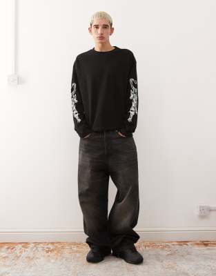 Weekday Oversized Boxy Fit Long Sleeve T-shirt With Panther Sleeve Graphic In Black