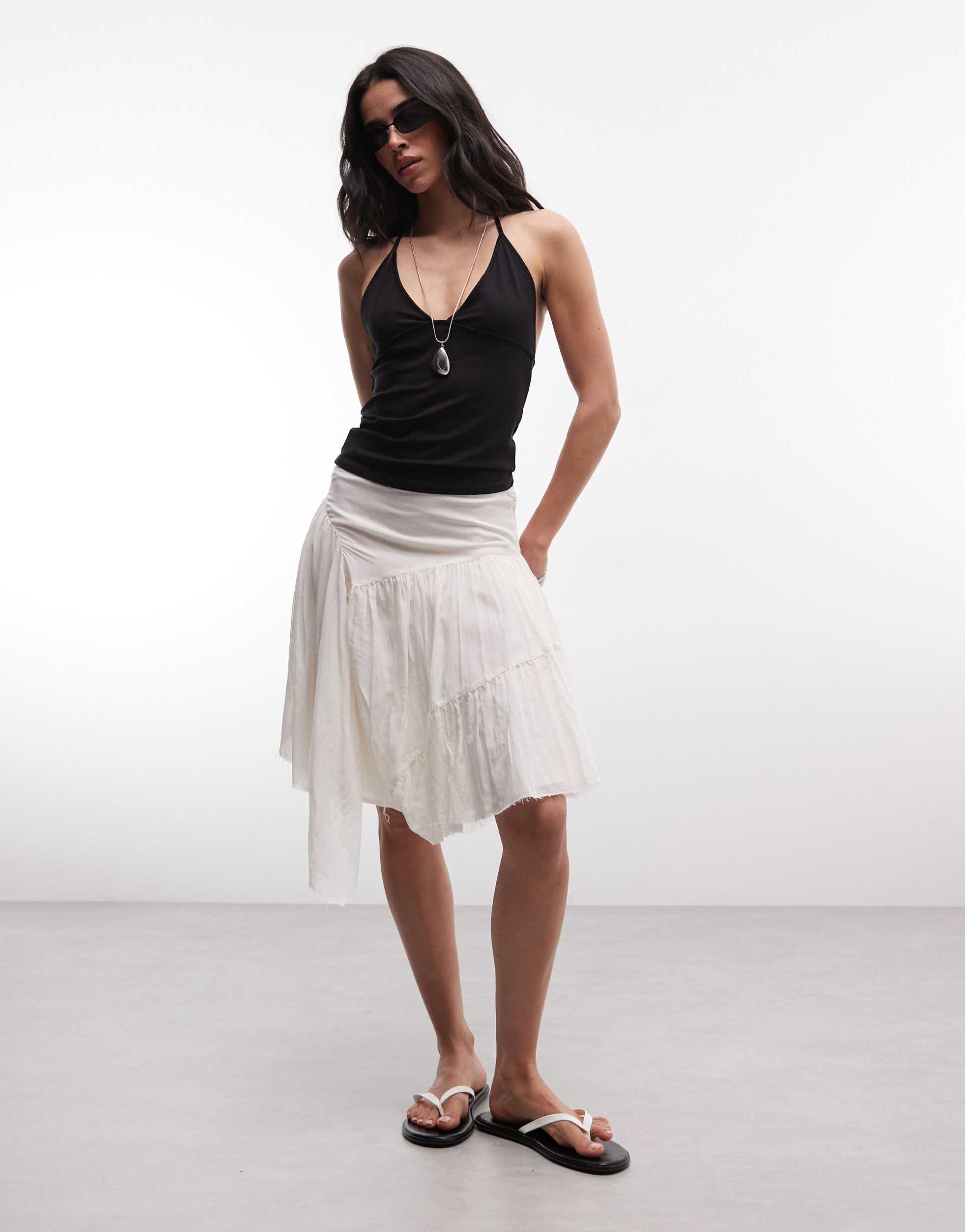 weekday pleated asymmetric cut midi skirt in off-white