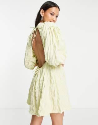 Weekday Weekday puff sleeve tie back mini dress in pale green