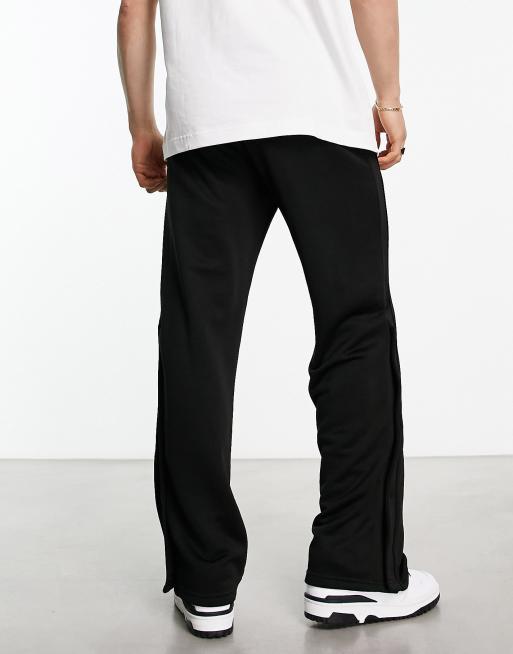 Weekday Raheem smart jersey trousers with side poppers in black