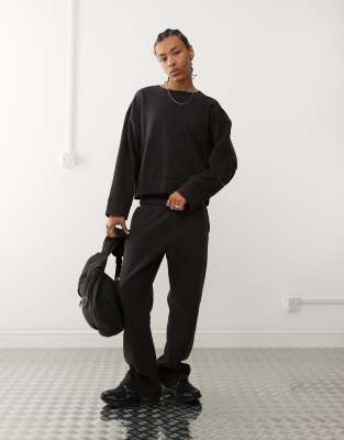 relaxed sweatpants in black acid wash - part of a set