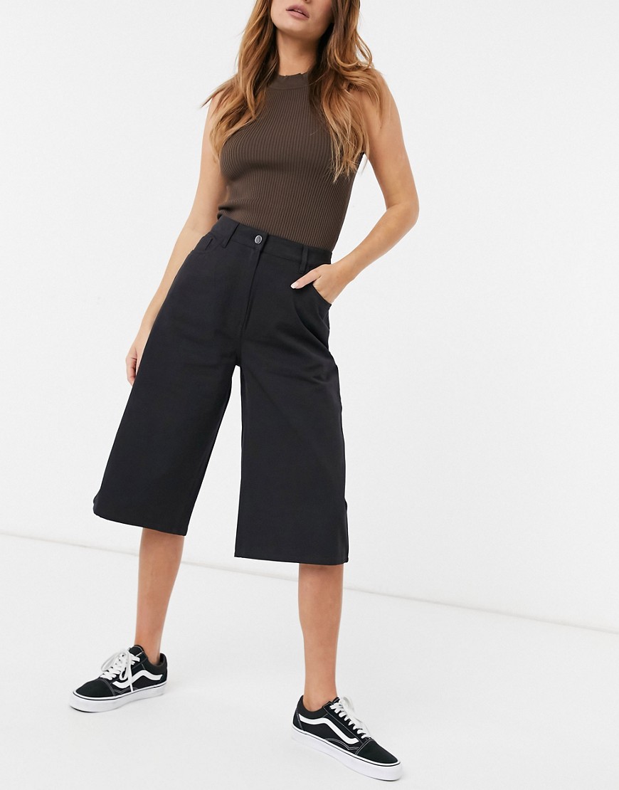 Weekday Rue organic cotton blend longline shorts in washed black