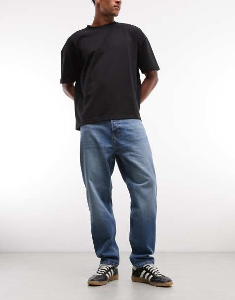 Weekday – Schmal zulaufende Relaxed-Fit-Jeans in mittelblauer Waschung - view 1