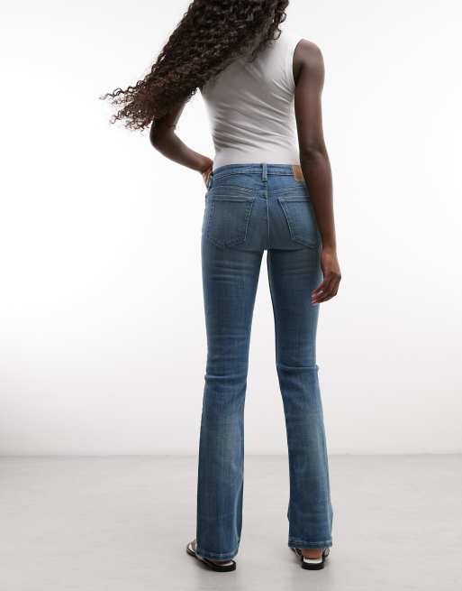 Weekday - Skinny flared jeans met lage taille in vervaagd middenblauw, 3 van 5