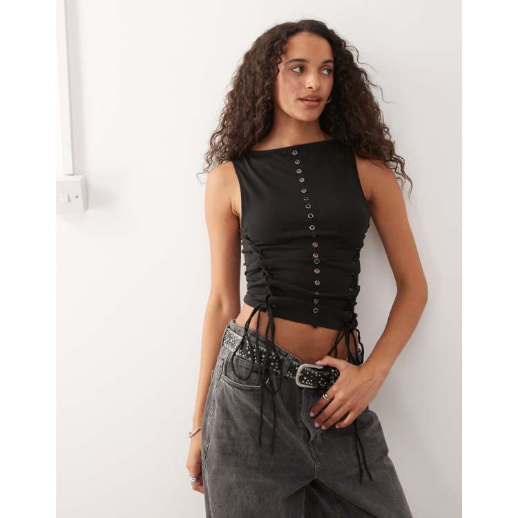 Weekday sleeveless eyelet top with tie up sides in black | ASOS