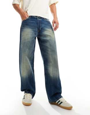 Sphere low waist loose fit jeans in blue streaky wash