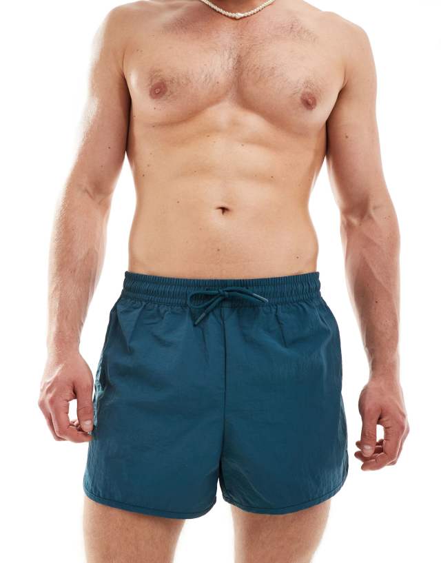 Weekday - tan runner swim shorts in petrol blue