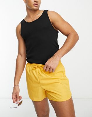 Tan swim shorts in yellow