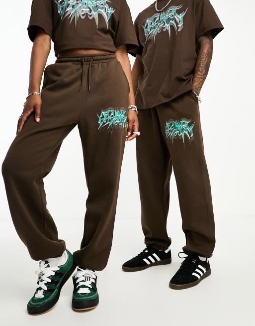 Weekday Unisex graphic sweatpants in brown exclusive to ASOS