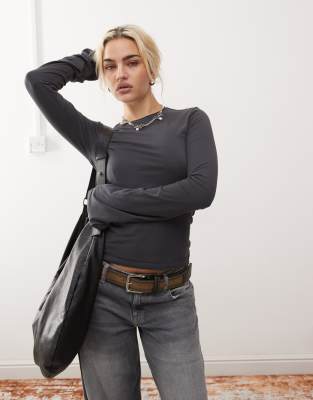 Violet long bell sleeve top with roll neckline in washed black