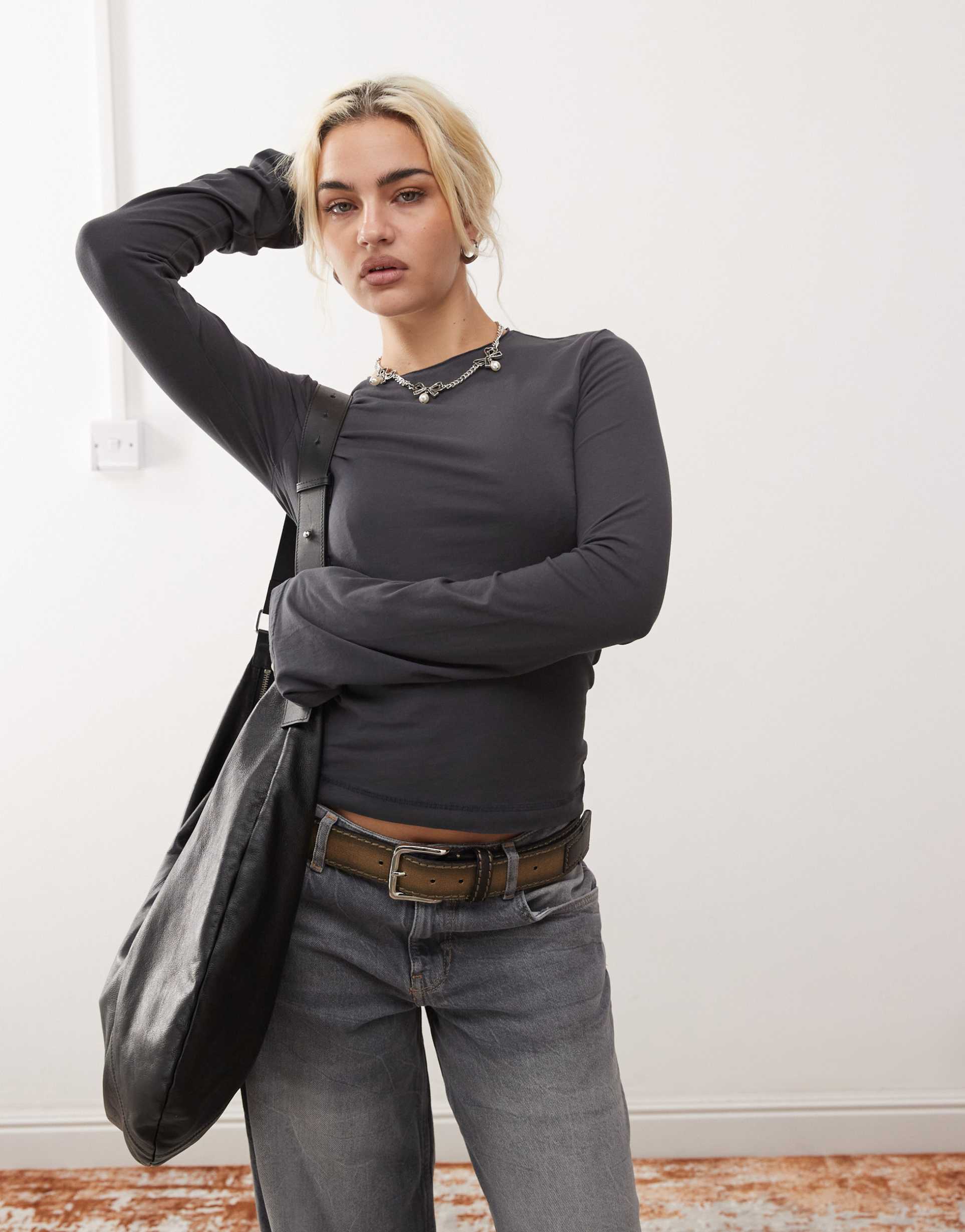 weekday violet long bell sleeve top with roll neckline in washed black