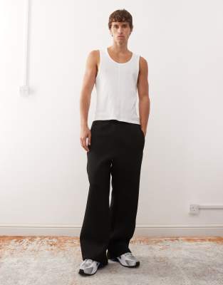 Weekday Weekday wide leg black joggers in scuba-style fabric