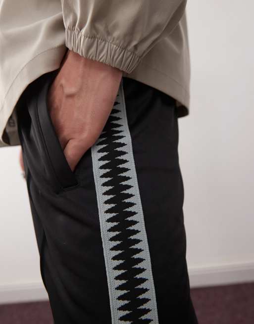 Weekday wide leg sweatpants with side tape details in black