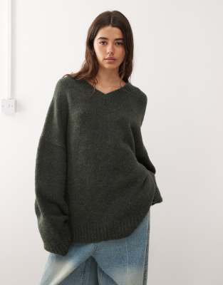 Weekday Weekday wool blend super oversized v neck jumper in dark green melange