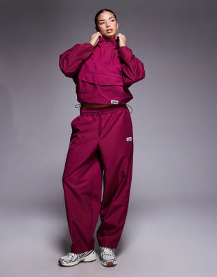 Asos Weekend Collective Weekend Collective Barrel Leg Nylon Sweatpants In Burgundy