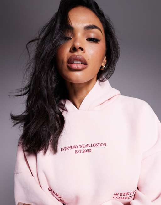 Weekend Collective hoodie with bright pink label detail in washed pink, 3 of 4