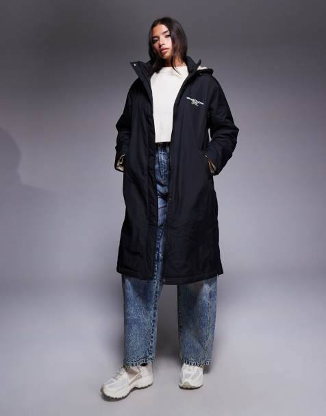 Weekend Collective longline coat with borg lining and graphic in black and cream - view 1