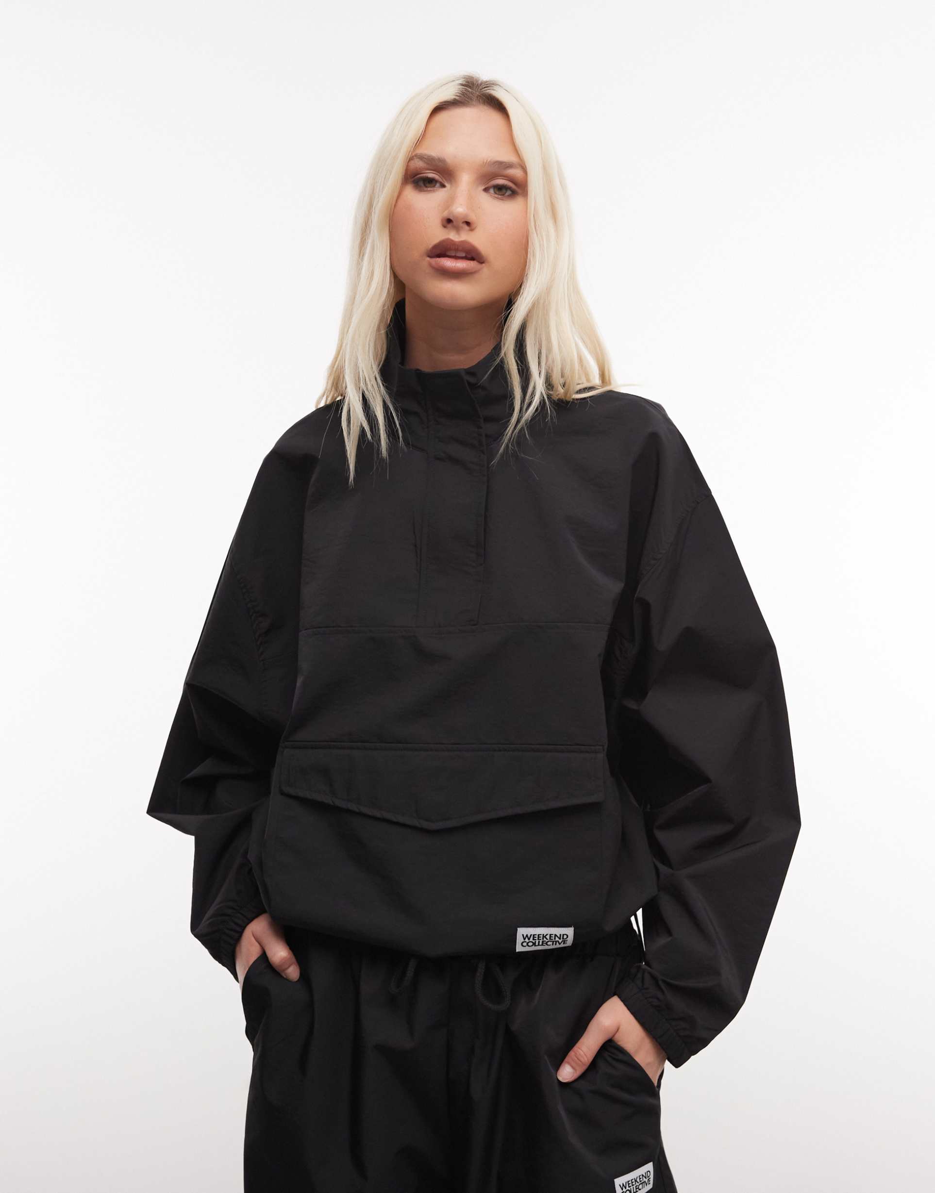 weekend collective nylon funnel neck windbreaker in black - part of a set