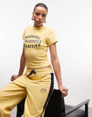 Asos Weekend Collective Weekend Collective Ribbed Baby Tee With Athleisure Graphic In Yellow