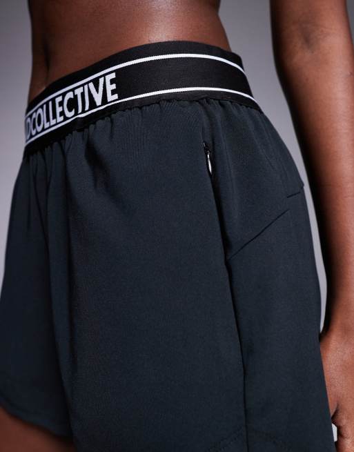 Weekend Collective running shorts in black with branded waistband, 4 of 5