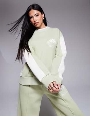 Weekend Collective ski sweatshirt with seam details in sage green - part of a set