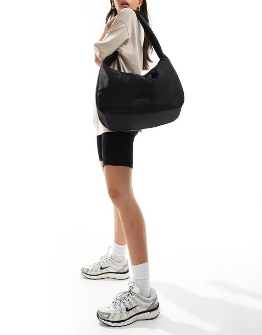 Weekend Collective - Sort sling-taske