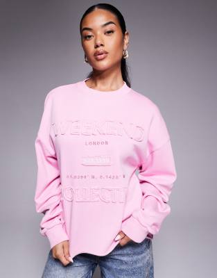 Weekend Collective - Sweatshirt in Rosa mit Applikation
