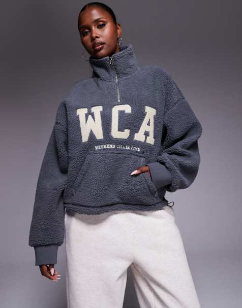 Weekend Collective half zip cropped borg in grey with varsity graphic detail