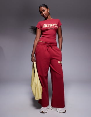 ASOS Weekend Collective Weekend Collective wide leg jogger with mixed font graphic in burgundy-Red