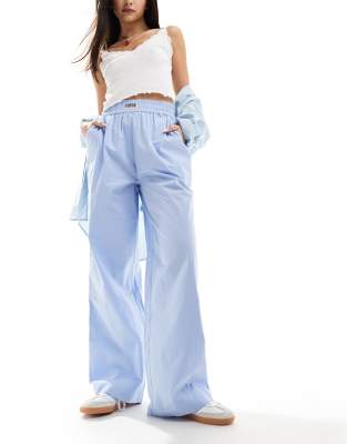 Weekend Collective woven trousers with label in blue poplin