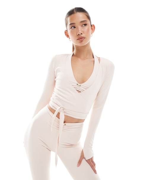 WeWoreWhat active long sleeve wrap top in pale pink