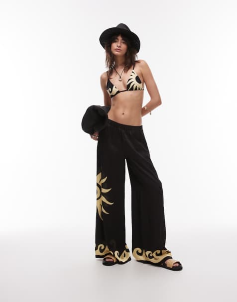 WeWoreWhat sun wave placement wide leg beach pants in black - view 1