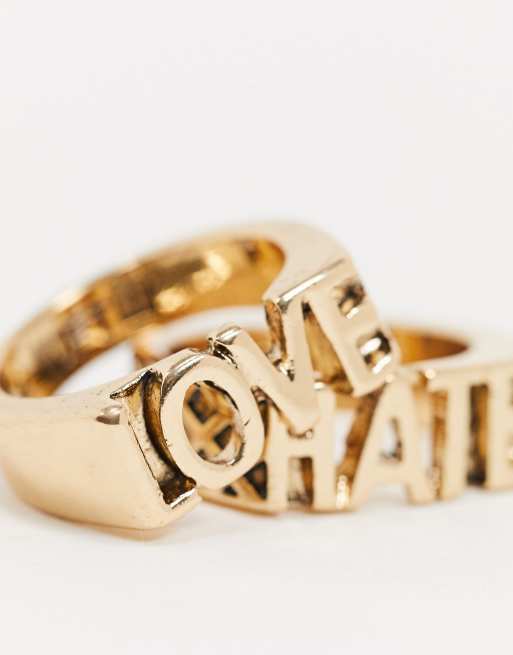 WFTW slogan ring set in gold with love hate text