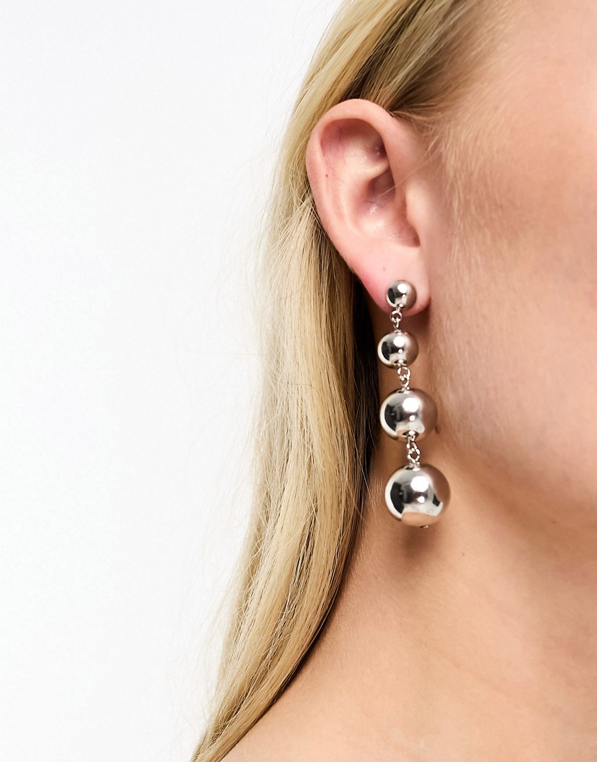 whistles dangle sphere earrings in silver