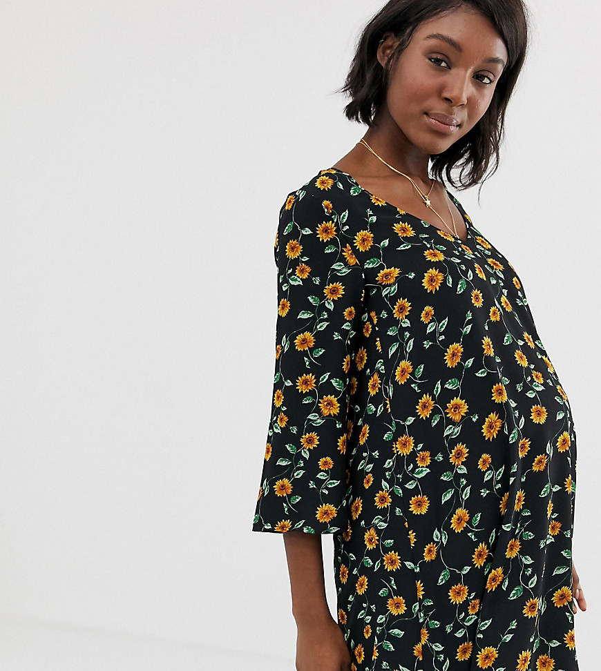 Wild Honey Maternity – Vid klänning med solrosmönster-Svart