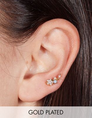 With Bling blue star crawler piercing with 6mm titanium bar in 18k gold plate