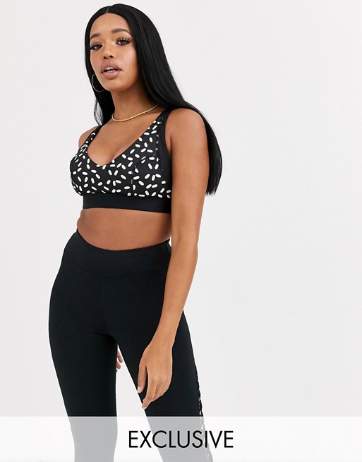 Wolf & Whistle fuller bust graphic print sports bra with mesh sides in black